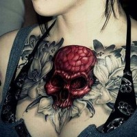 Spooky red skull and lilies chest tattoo