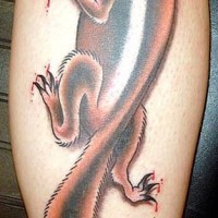 Squirrel tattoo climbing on leg