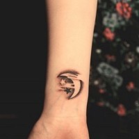 Stars and moon tattoo on wrist