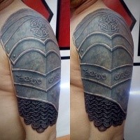 Steel like colored shoulder armor tattoo stylized with Celtic symbol