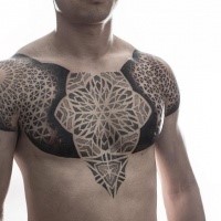 Stippling black ink chest tattoo of ornamental flowers