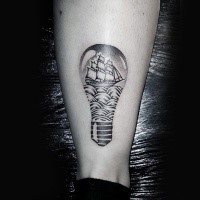 Stippling style black ink ankle tattoo of bulb with sailing ship