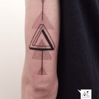 Stippling style black ink arm tattoo of triangles