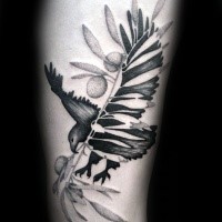 Stippling style black ink arm tattoo of bird with olive branch