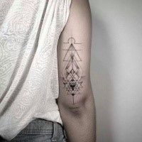 Stippling style black ink arm tattoo of geometrical figures