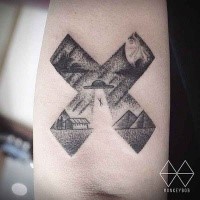 Stippling style black ink cross shaped arm tattoo stylized with alien ship stealing human