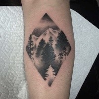 Stippling style black ink forearm tattoo of mountain forest