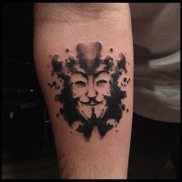 Stippling style black ink forearm tattoo of funny mask