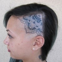 Stippling style black ink head tattoo of typical Hinduism flower