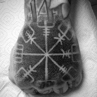 Stippling style black ink mystical ornament tattoo on fist