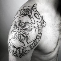 Stippling style black ink shoulder tattoo of Celtic symbols with cross