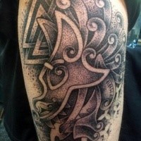 Stippling style black ink shoulder tattoo of various ornaments