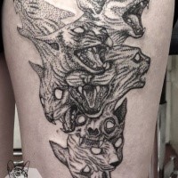 Stippling style black ink thigh tattoo of wild cats