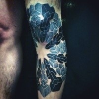 Stippling style colored leg tattoo of interesting ornament