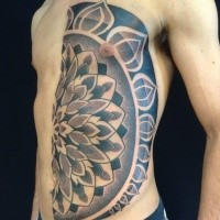 Stippling style half chest and belly tattoo of big flower