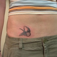 Stomach tattoo, flying, dreamful gray bird