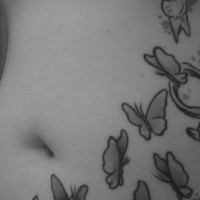 Stomach tattoo, many gray butterflies, teeth