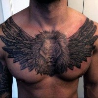 Stone like black ink chest tattoo of lion head with angel wings