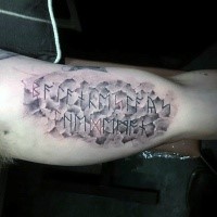 Stone like colored biceps tattoo of ancient lettering