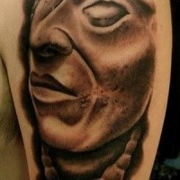 Stonework shoulder tattoo of antic statue