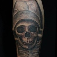 Stonework style arm tattoo of skeleton with hat