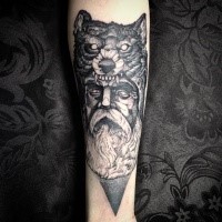 Stonework style black ink forearm tattoo of old man with wolf helmet