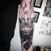 Stonework style black ink forearm tattoo of deers head