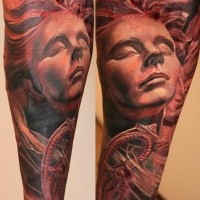 Stonework style colored forearm tattoo of woman statue