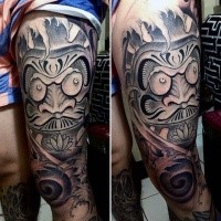 Stonework style colored thigh tattoo of daruma doll statue