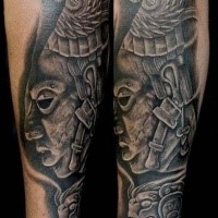 Stonework style forearm tattoo of ancient stone statue