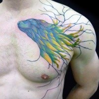 Stonework style half colored mystical animal statue tattoo on chest and shoulder