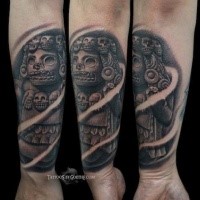 Stonework style medium size forearm tattoo of ancient Mayan statue