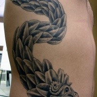 Stonework style side tattoo of fantasy dragon