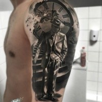 Strange looking black ink shoulder tattoo of vintage man with clock