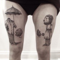 Strange looking black ink thighs tattoo of lion on tree and human with umbrella
