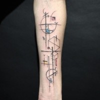 Strange looking colored forearm tattoo of various geometrical figures
