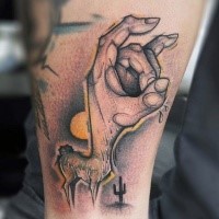 Strange looking colored tattoo of deer with human hand and cactus