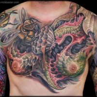 Strange painted colored bee tattoo on chest with alien like leaves