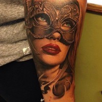 Stunning accurate painted detailed beautiful forearm tattoo of woman in mask