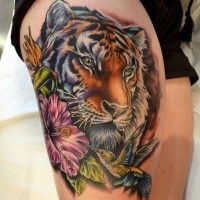 Stunning accurate painted thigh tattoo of tiger portrait with flowers and birds