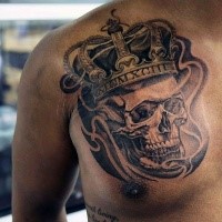 Stunning black and white chest tattoo of king skull with crown
