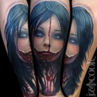 Stunning bloody colored horror girl tattoo on arm