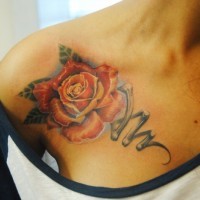 Stunning colored big mechanical rose tattoo on shoulder