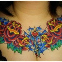 Stunning colored big roses with heart tattoo on chest