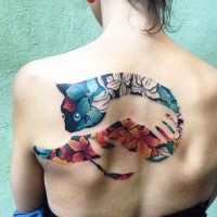 Stunning colored upper back tattoo of human hand holding cat stylized with leaves