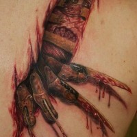 Stunning designed and colored realistic Freddy Kruger bloody tattoo on shoulder