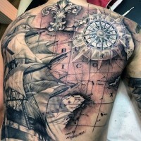 Stunning designed and painted colored world map with compass and ship tattoo on whole back