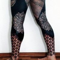Stunning designed and painted multicolored tribal ornaments tattoo on whole legs