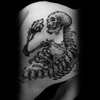Stunning large black ink whole back tattoo of demonic human skeleton