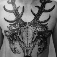 Stunning looking black and white chest tattoo of mystical deer animal